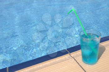 Royalty Free Photo of a Cocktail Beside a Pool