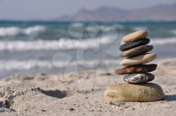 Royalty Free Clipart Image of a Pebble Stack on Kos Beach