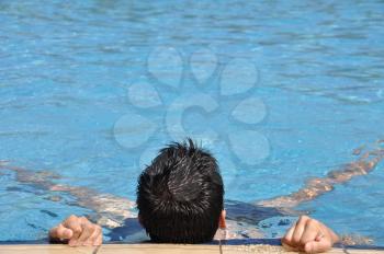 Royalty Free Photo of a Man in a Pool