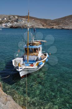 Royalty Free Photo of a Fishing Boat at the Bay of Pserimos Island, Greece