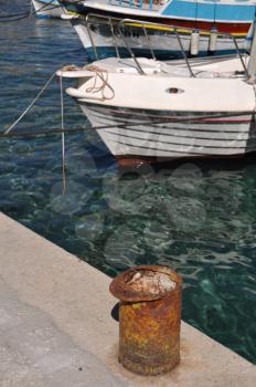 Royalty Free Photo of a Metal Mooring Bollard at Pserimos Docks, Greece