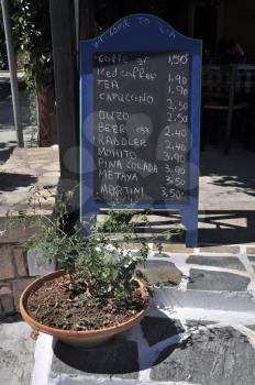 Royalty Free Photo of a Restaurant With a Chalkboard Menu in Zia (Kos island), Greece
