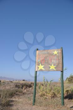 Royalty Free Photo of a Beach Wooden Sign at Kos Island, Greece 