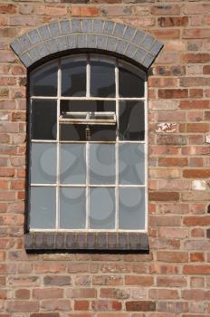 Royalty Free Photo of a Window on a Brick Wall