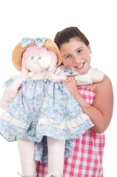 Royalty Free Photo of a Little Girl Holding a Doll