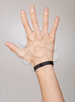 Royalty Free Photo of a Hand Wearing a Bracelet