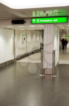 Royalty Free Photo of an Emergency Exit Sign at an International Airport
