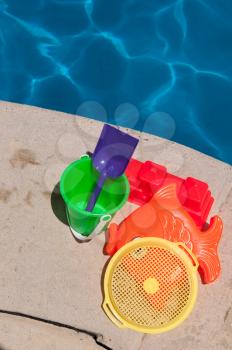 Royalty Free Photo of Toys By the Poolside