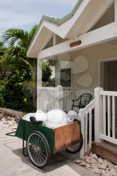 Royalty Free Photo of a Cleaning Cart Outside a Villa