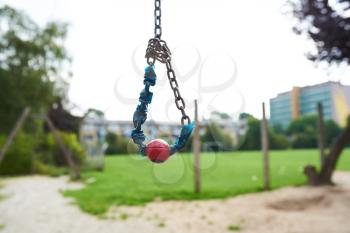 Closeup of a small cable swing at a park playground for children