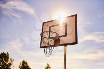 A old basketball net in the sun