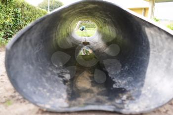 looking through a tunnel on a playground