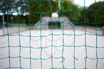 Closeup of a blue net at a soccer playground