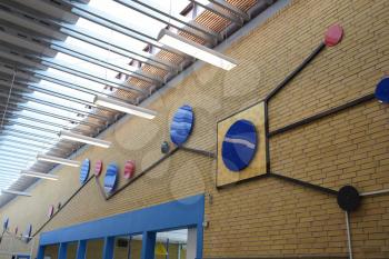 Blue art hanging in a school building