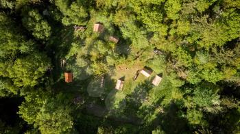 a drone shot of camping site in a forest