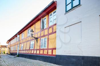 an old scandinavian building in a narrow street