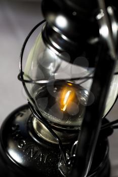 Closeup of a oil lamp with a flame
