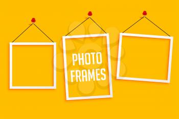 hanging photo frames on yellow background