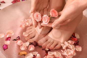 Young woman undergoing spa pedicure treatment in beauty salon, closeup�
