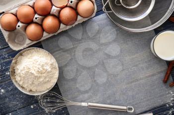 Flat lay composition with kitchen utensils and products on wooden background. Bakery workshop�