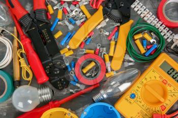 Flat lay composition with electrical tools on grey background�