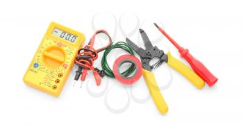 Different electrical tools on white background, top view�
