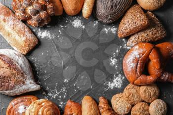 Different bakery products on gray background�
