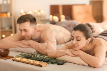 Young couple relaxing in spa salon�