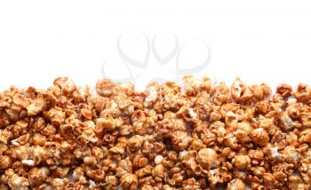 Delicious popcorn with caramel on white background�