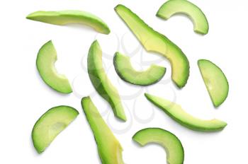 Slices of ripe avocado on white background�
