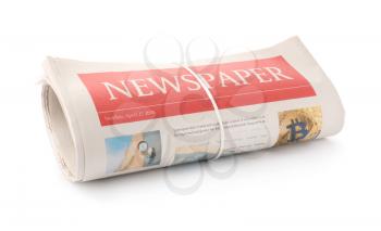 Rolled newspapers on white background�