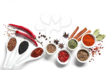 Composition with various spices on white background�