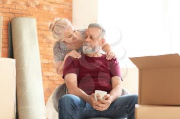 Happy mature couple indoors. Moving into new house�