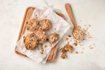 Composition with delicious oatmeal cookies on light background�