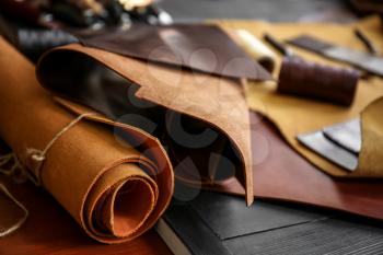 Pieces of leather on table�