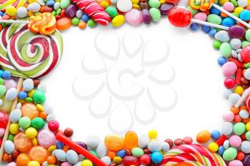 Frame made of colorful candies on white background�
