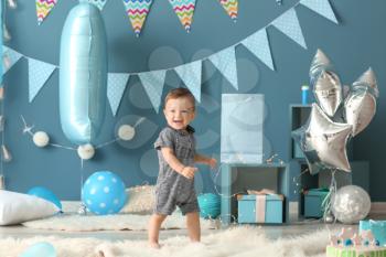 Cute little boy in room decorated for birthday party�