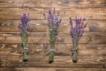 Bunches of lavender on wooden table�