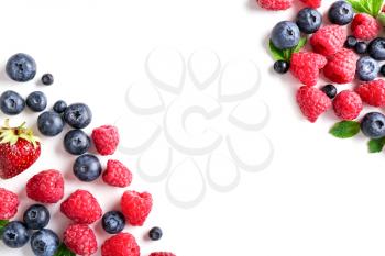 Delicious ripe berries on white background, top view�