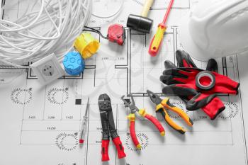 Different electrician's supplies on electrical scheme�