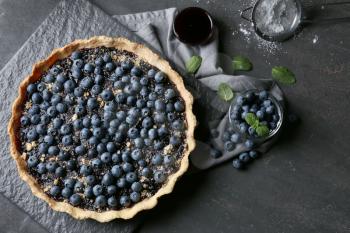 Delicious blueberry pie on table, top view�
