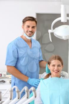 Dentist and his patient in clinic�