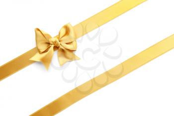 Golden ribbons with bow on white background�