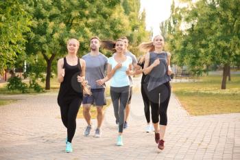 Group of sporty people running outdoors�