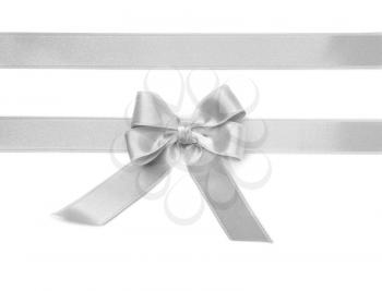 Silver ribbons with bow on white background�