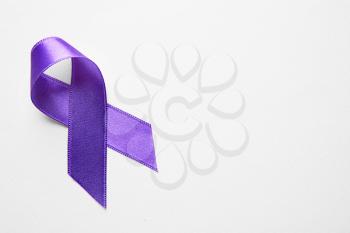 Purple ribbon on light background. Cancer concept�