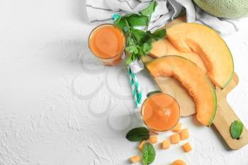 Composition with delicious melon smoothie on white table�