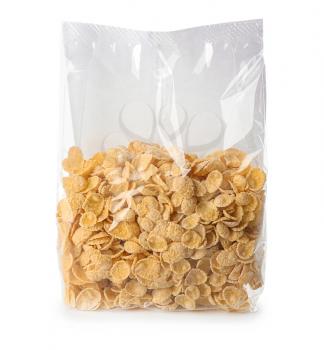 Package with healthy cornflakes on white background�