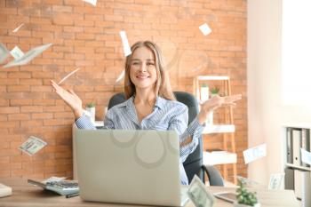 Happy businesswoman with lot of money in office�