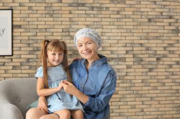 Little girl and her mother after chemotherapy at home�